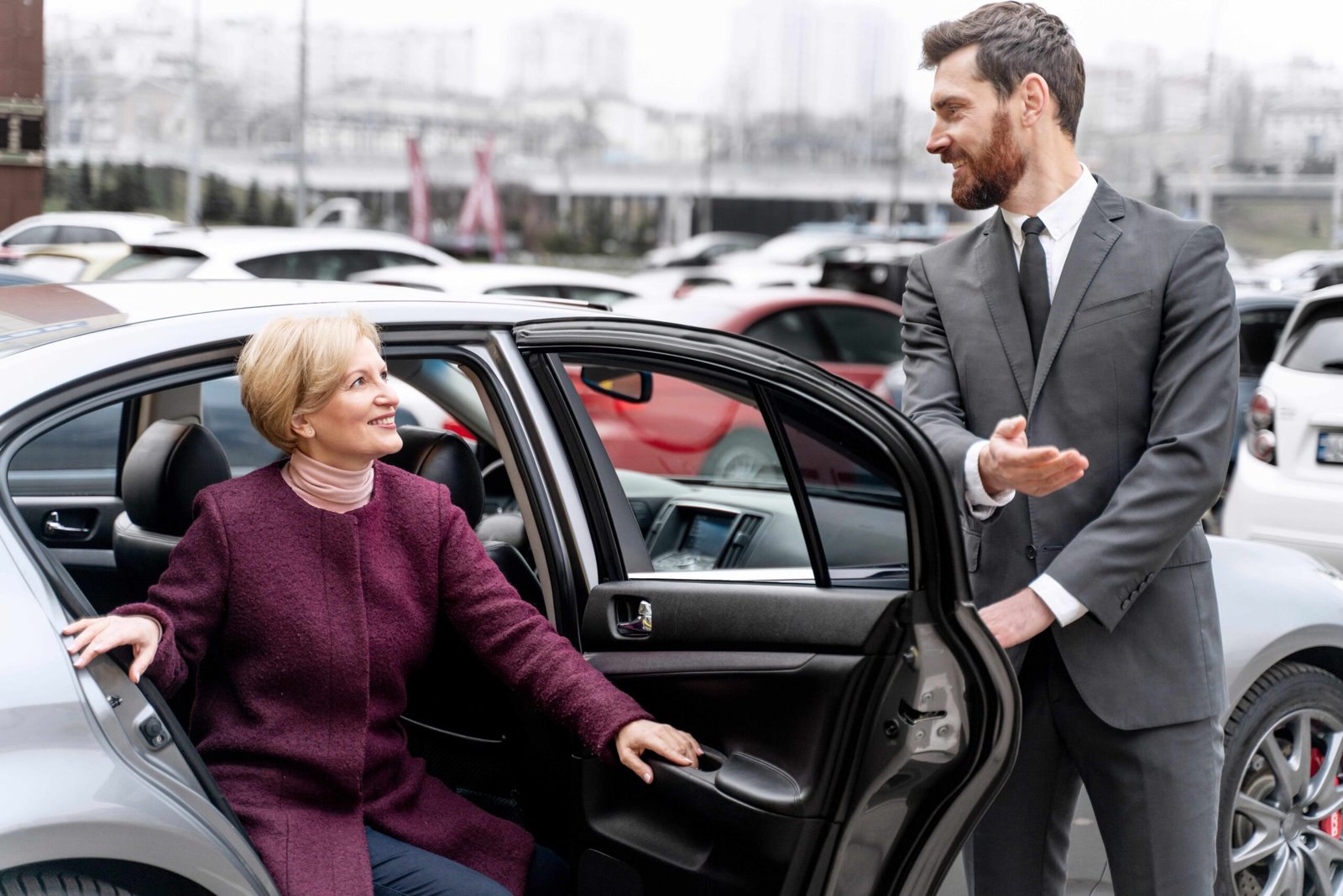 Taxi driver helping a female passenger